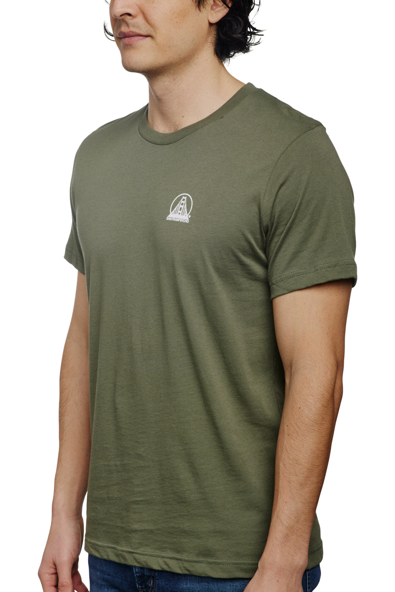 A man wearing the Military Green Mini Logo Tee from the basics line stands against a white background.