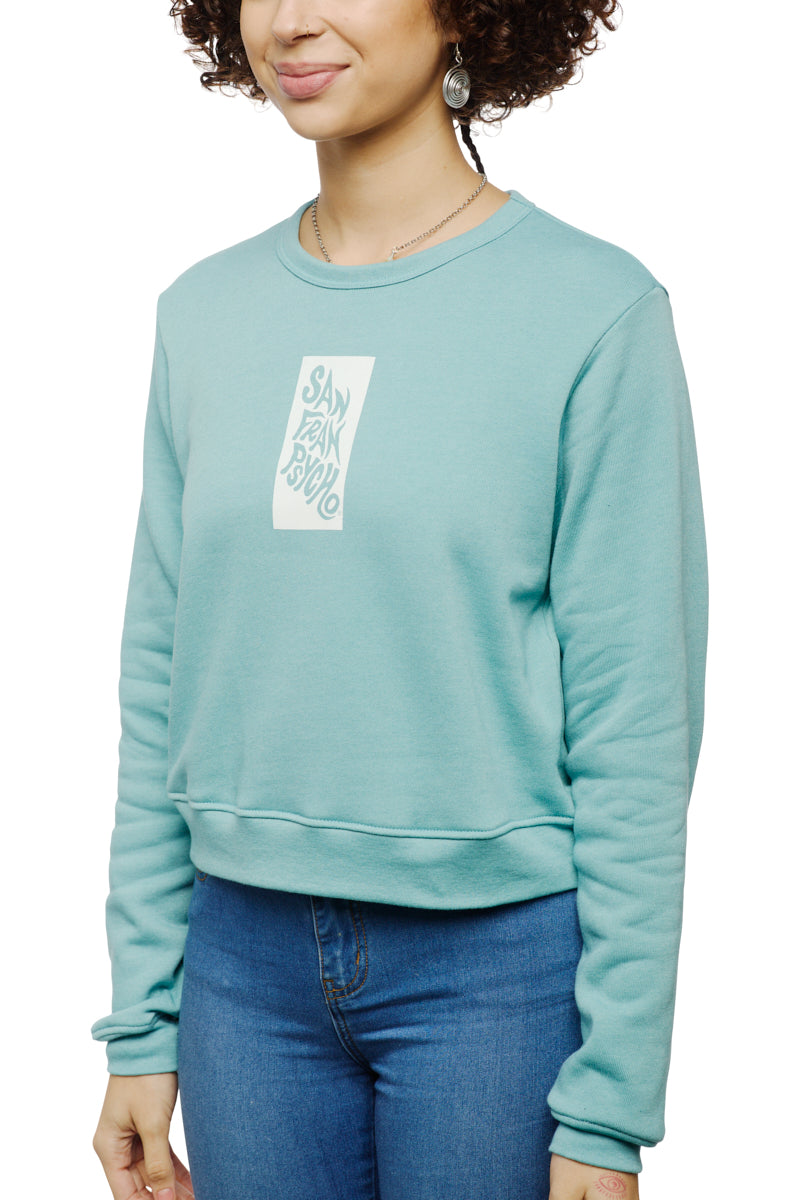 Person wearing the Trippy Psycho Women's Crewneck from the Spring 2023 Collection, featuring San Francisco text and crafted from an ultra-soft cotton/polyester blend, paired with blue jeans.