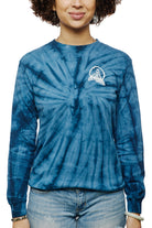 A person in a Tie-Dye Acid Logo Long Sleeve - Navy pairs it with light jeans, smiling slightly.