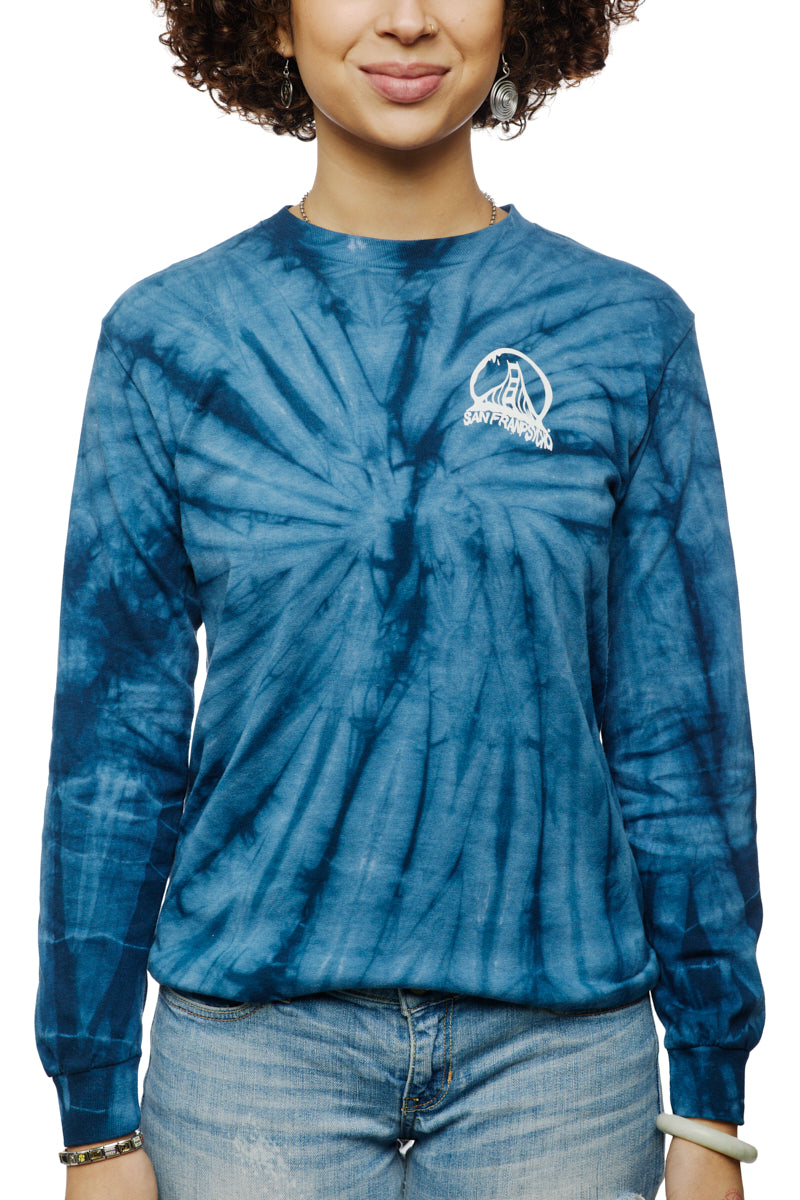 A person in a Tie-Dye Acid Logo Long Sleeve - Navy pairs it with light jeans, smiling slightly.
