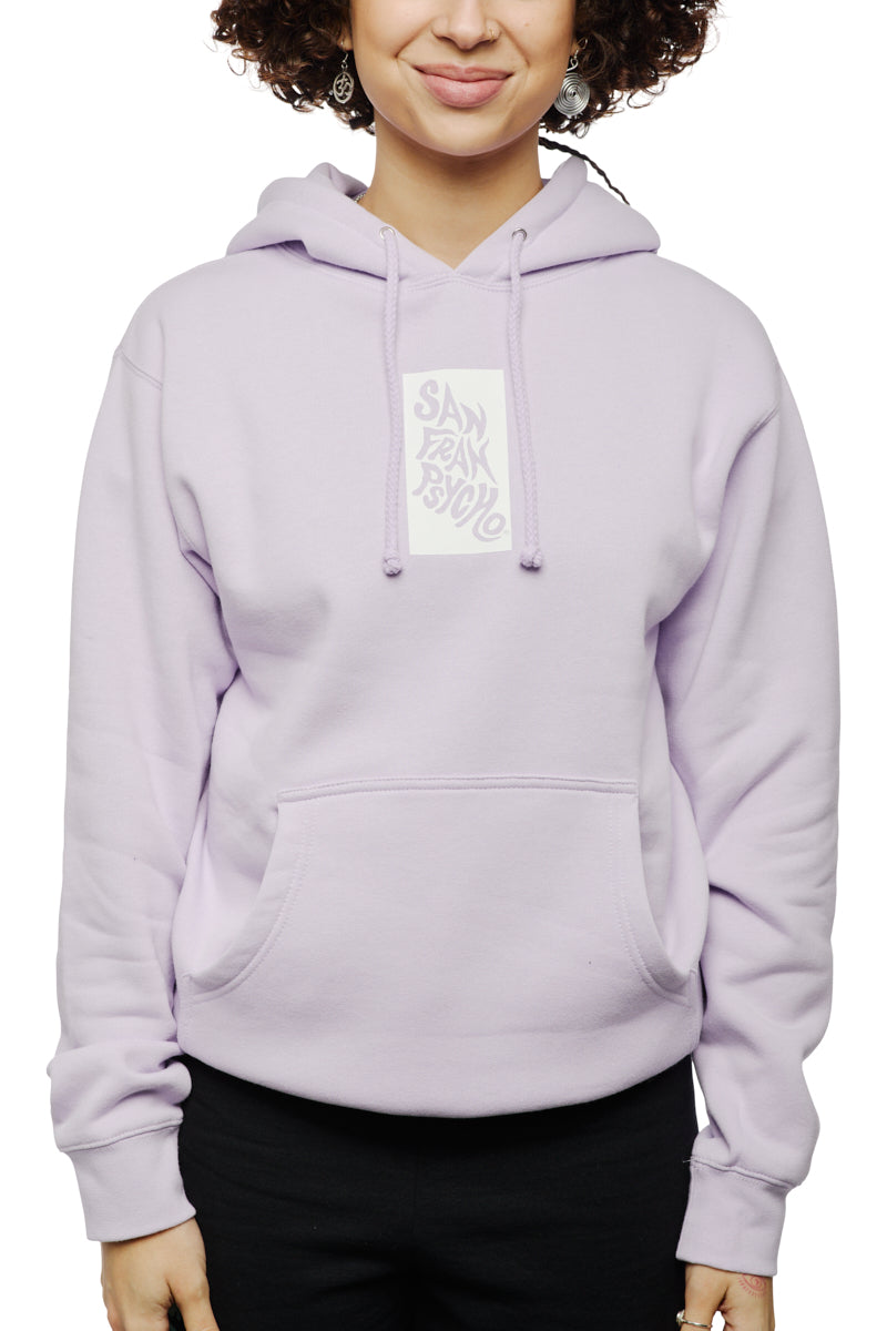 A person wearing a Trippy Psycho Pullover Hoodie in light purple from the Spring 2023 Collection, featuring a pocket and subtle design, smiling softly.