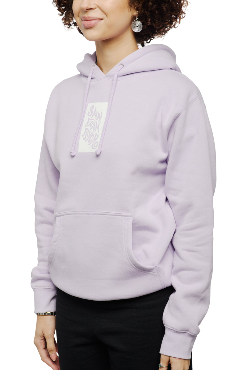 A person wearing the Trippy Psycho Pullover Hoodie from the Spring 2023 Collection, in light purple, paired with black pants, stands against a white background.