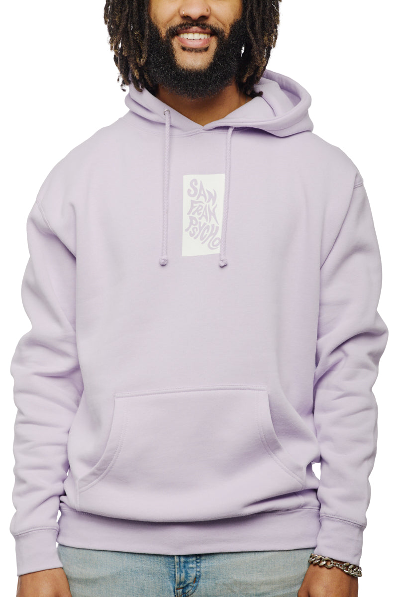 The man wearing a light purple Trippy Psycho Pullover Hoodie featuring a text design on the front is smiling against a white background. This unisex hoodie is from the vibrant Spring 2023 Collection.