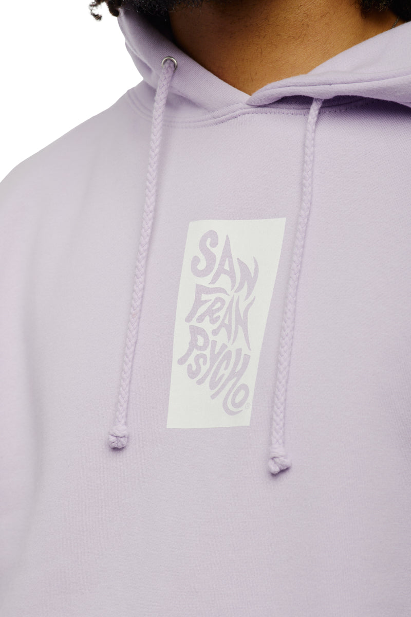 Wearing the Trippy Psycho Pullover Hoodie from the Spring 2023 Collection, this unisex lavender piece prominently displays "San Fran Psycho" on the front, combining style with comfort seamlessly.