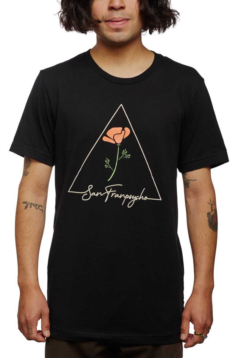 A person wears the California Poppy Tee, a black unisex shirt made from 100% cotton, showcasing a triangle design with a rose and the word San Franpsycho.