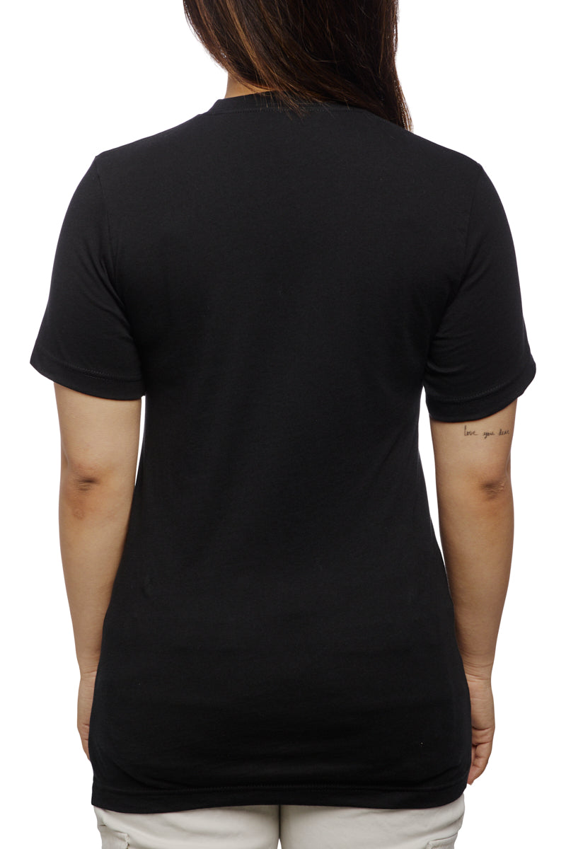 A person wearing a California Poppy Tee, a unisex shirt made from 100% cotton, along with light pants, seen from behind on a white background.