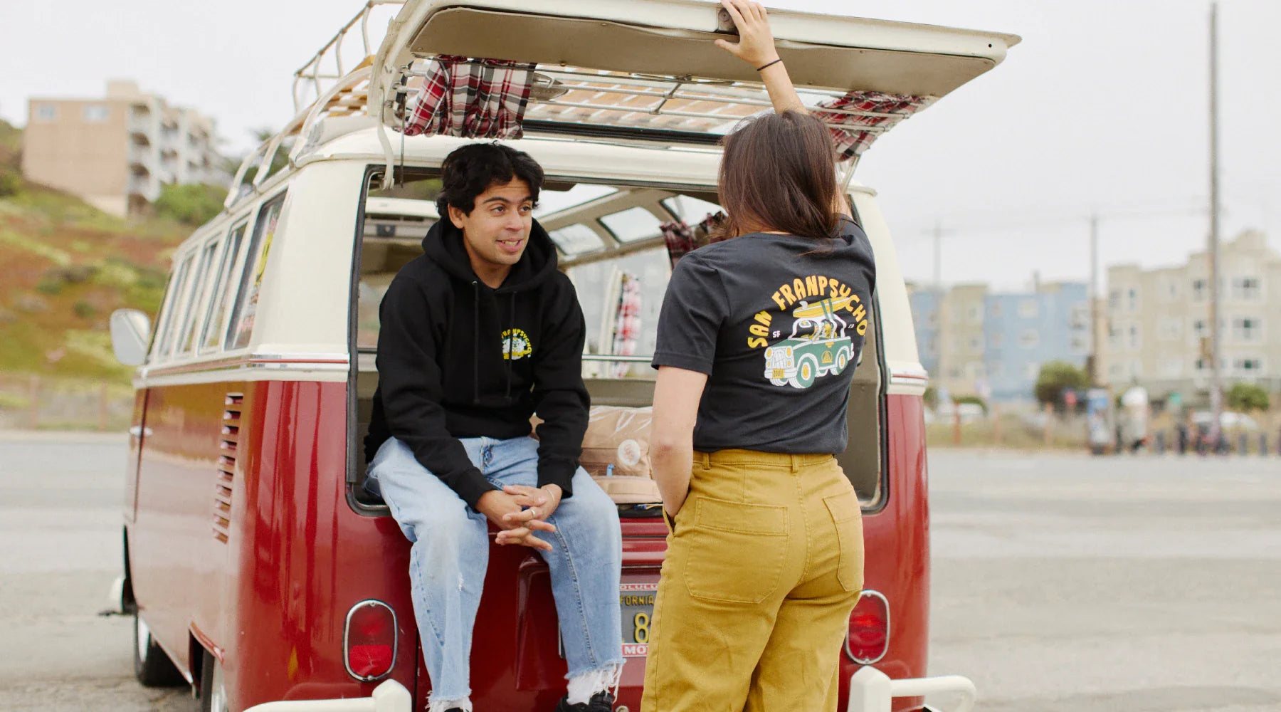 man and woman with a surfer van wearing ferris plock san franpsycho tee and sweatshirt