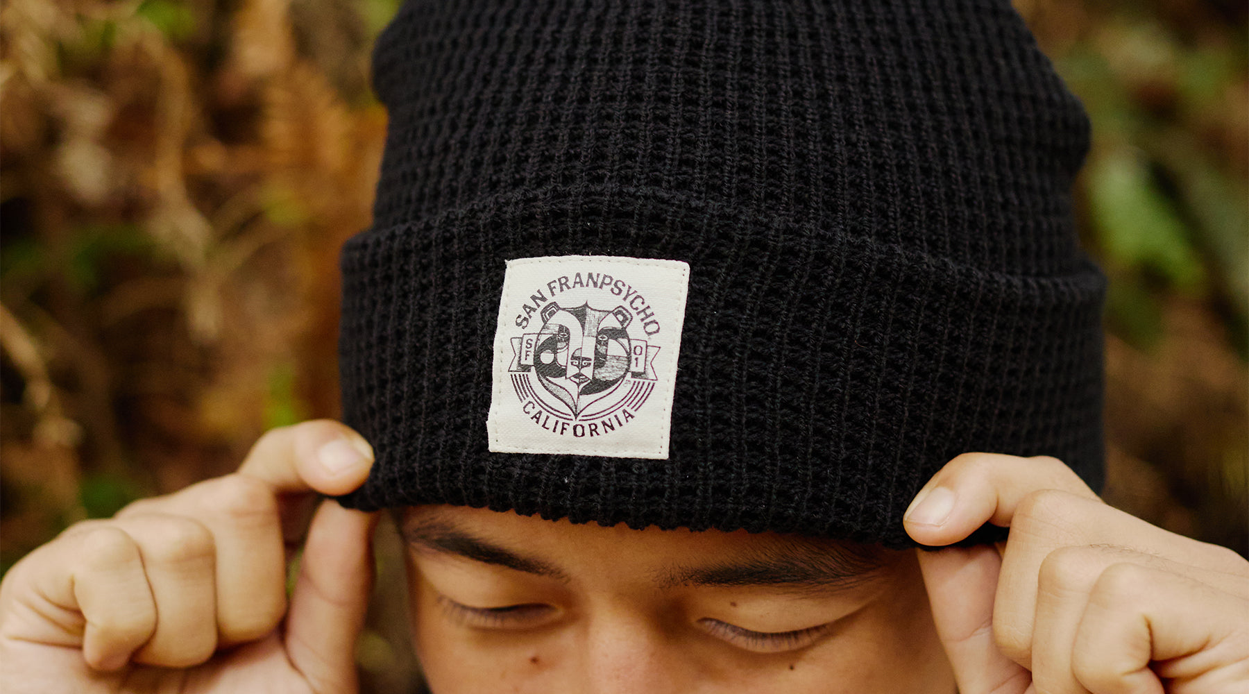 woman wearing ferris plock cat stamp beanie