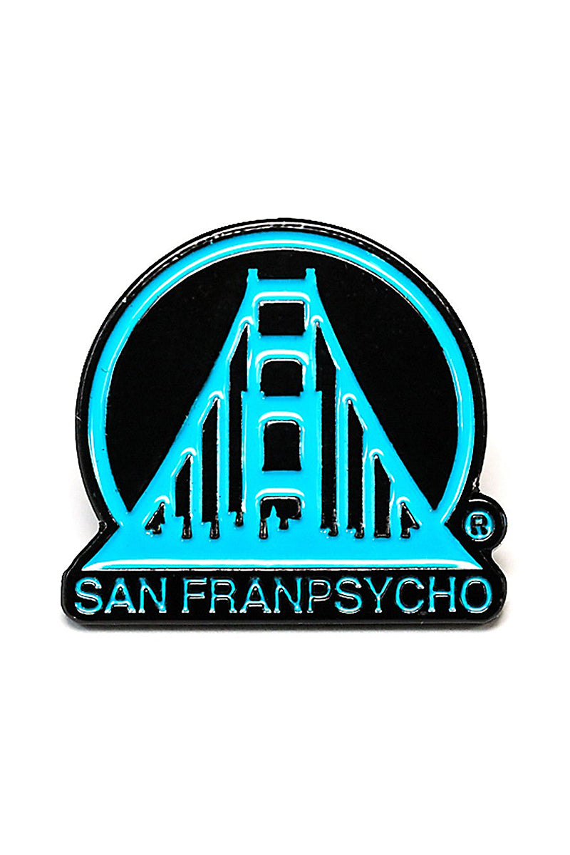 The Black & Blue SFP Logo Pin features a stylized turquoise bridge design with "San Franpsycho" elegantly inscribed beneath it on a sleek black background. It is secured with a standard clutch, making it both a stylish and practical accessory for pin enthusiasts.