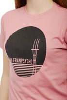The Youth Sutro Tower Tee, crafted from 100% cotton, features a pastel pink color with a black abstract graphic and text design.