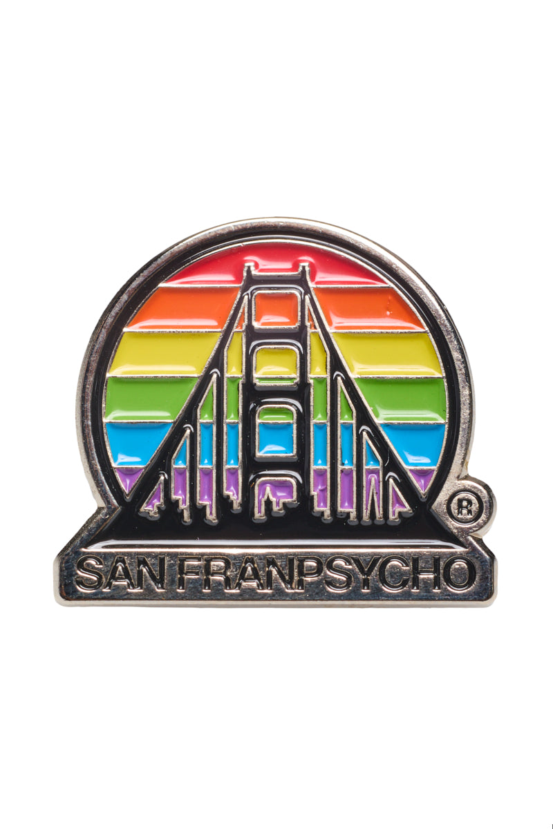 The Rainbow Logo Pin displays a stylized bridge design set against a vibrant rainbow, with the word San Franpsycho beneath it, celebrating PRIDE.