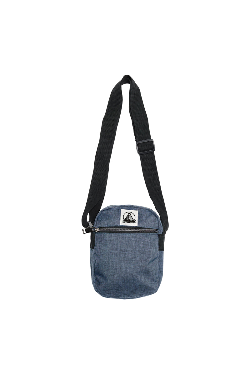 Small Sling Bag in blue with a black adjustable strap and a zippered front pocket for easy access.