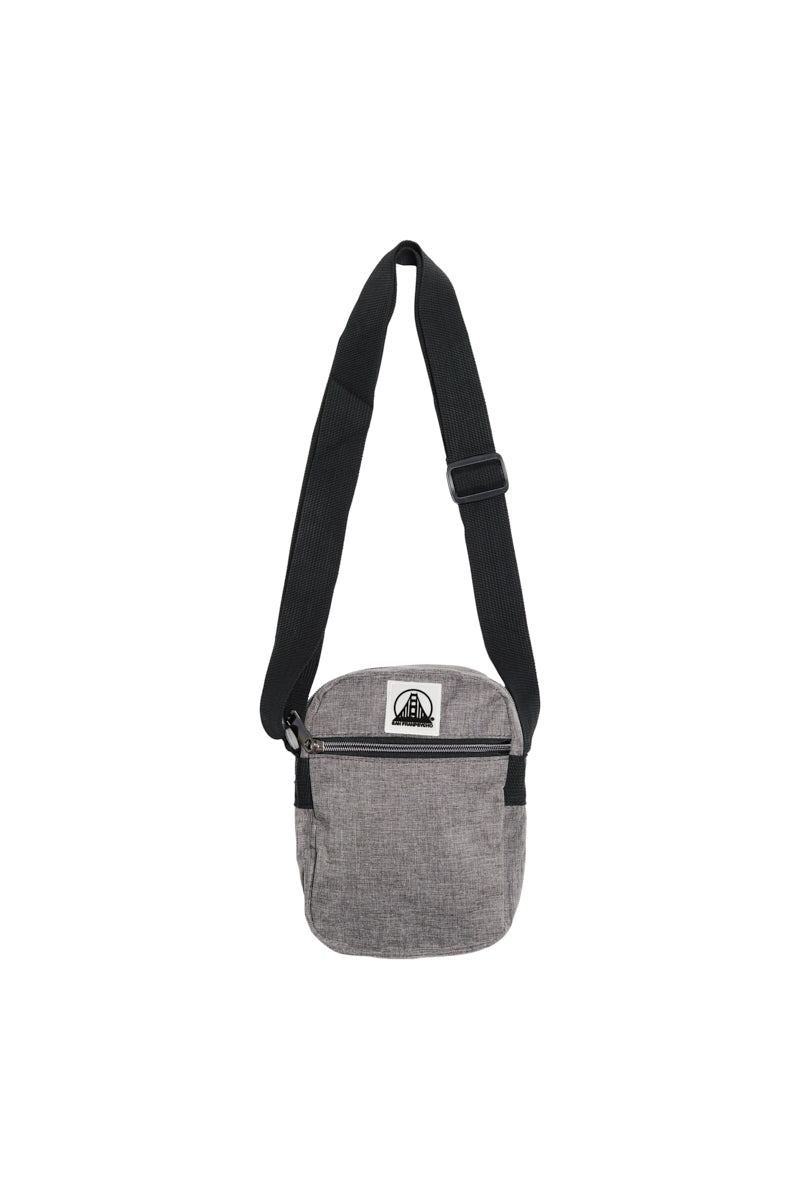 Small Sling Bag in gray featuring a black adjustable strap and a zippered front pocket, displayed on a white background.