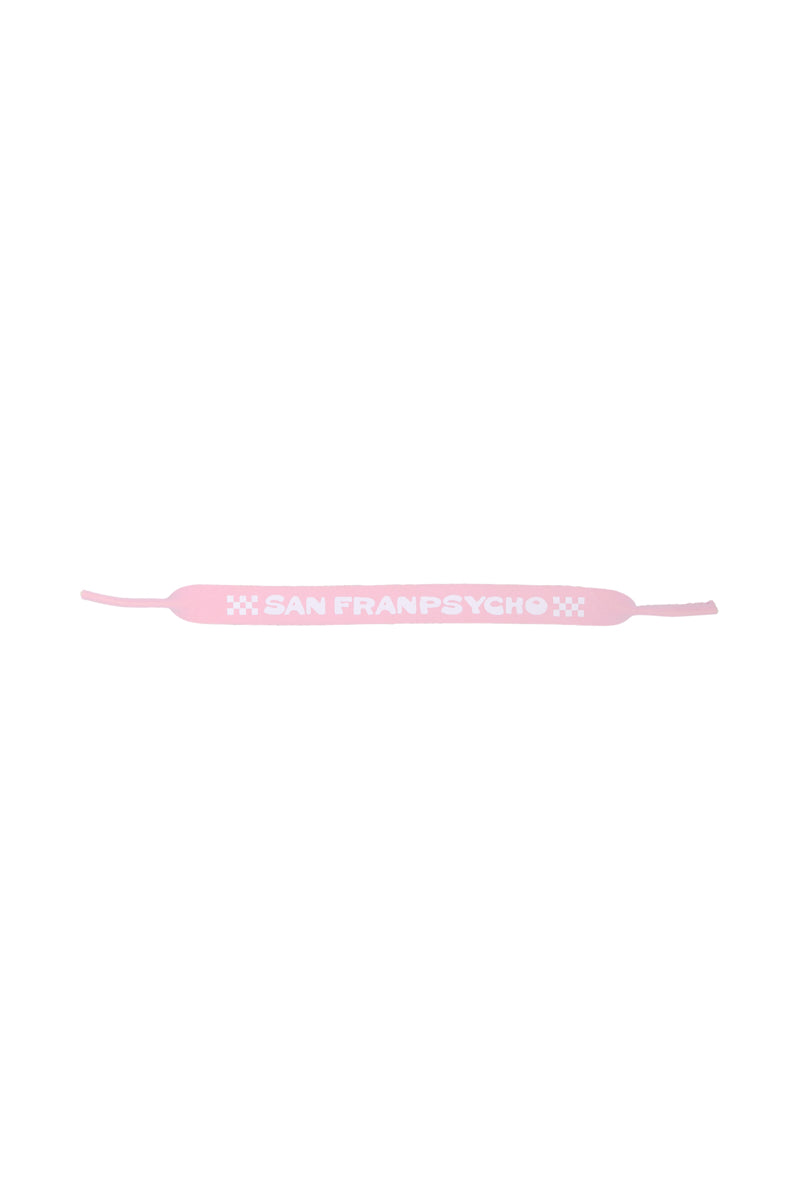 As part of the 80s-inspired collection, this pink Sunglasses Strap by San Franpsycho creates a striking contrast against a white background.