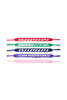 Four colorful Sunglasses Straps with various text designs are displayed on a white background, showcasing a vibrant, 80s-inspired collection by San Franpsycho.