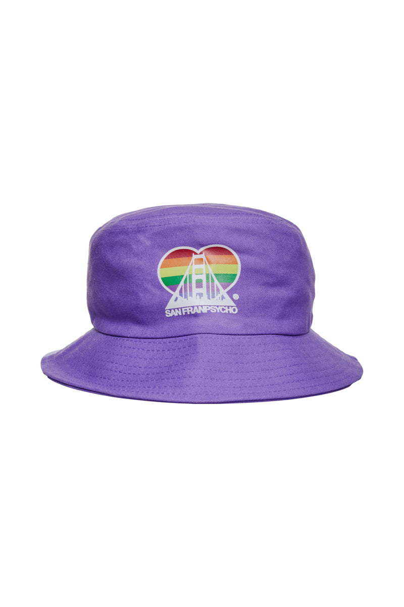 The Rainbow Logo Bucket Hat features a purple color with a heart-shaped design showcasing a bridge and sunset, enhanced by a rainbow logo and the text "SAN FRANCISCO" below.