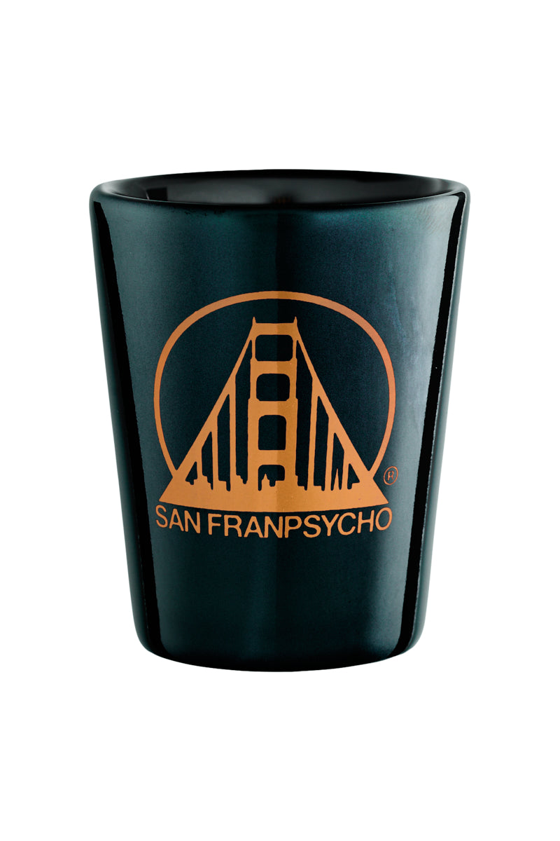 The Black/Orange Logo Shot Glass showcases a sleek design with a vibrant San Franpsycho logo featuring a stylized bridge, capturing the citys essence.