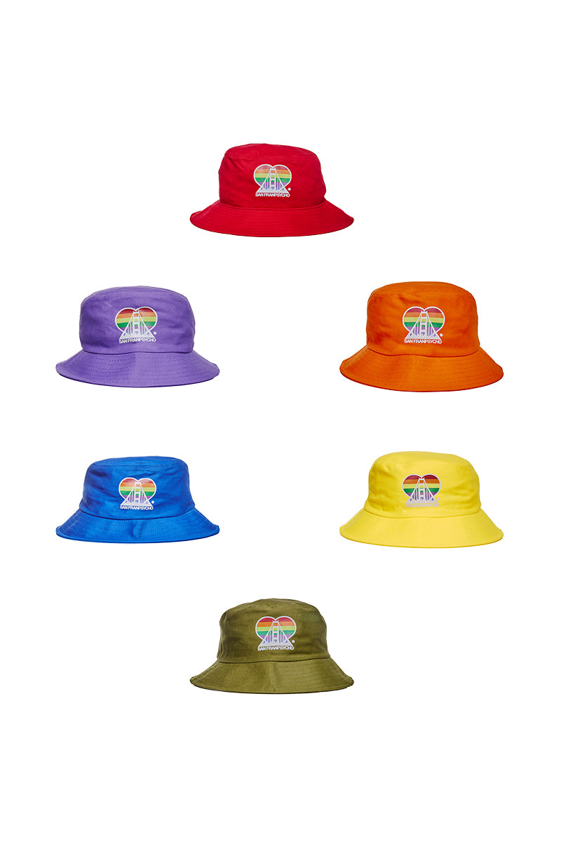 Introducing the Rainbow Logo Bucket Hat, a lively assortment of hats featuring a striking rainbow heart and the word AMIRI as its logo. Embrace pride and fashion while contributing to the SF LGBT Center with these distinctive accessories.