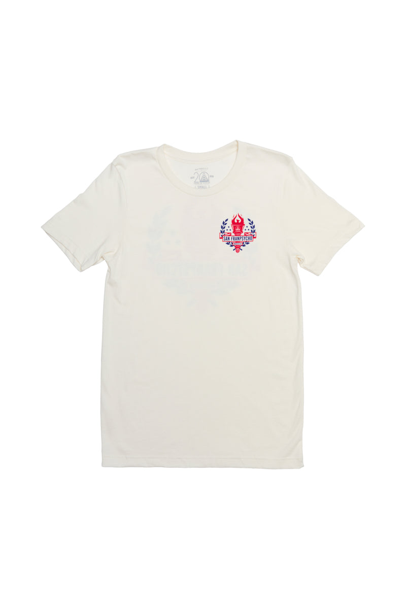 The Eternal Flame Tee is made from soft Airlume cotton, showcasing a vibrant emblem on the left chest against a crisp white backdrop.