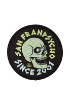 Round Zebra Skull Patch showcasing a vibrant green zebra skull logo and the phrase "San Franpsycho Since 2001" against a striking black background. Perfect for adding as an iron-on patch to customize your gear.