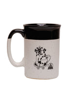 The Kitty Poof Mug is a ceramic mug featuring a playful cartoon character print, adorned with white and black speckles, and displays a logo at the bottom right. It holds up to 13oz of your preferred beverages.