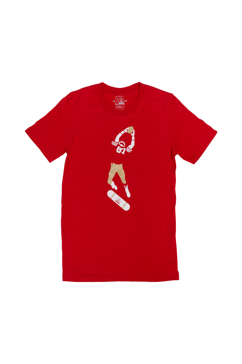 The Catch Tee: A vibrant red T-shirt showcasing a skateboarder mid-jump, equipped with a red helmet and wearing a number 63 jersey—a tribute to the Niners legacy and the essence of San Francisco.