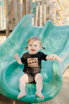 toddler on slide wearing Cat Stamp Onesie