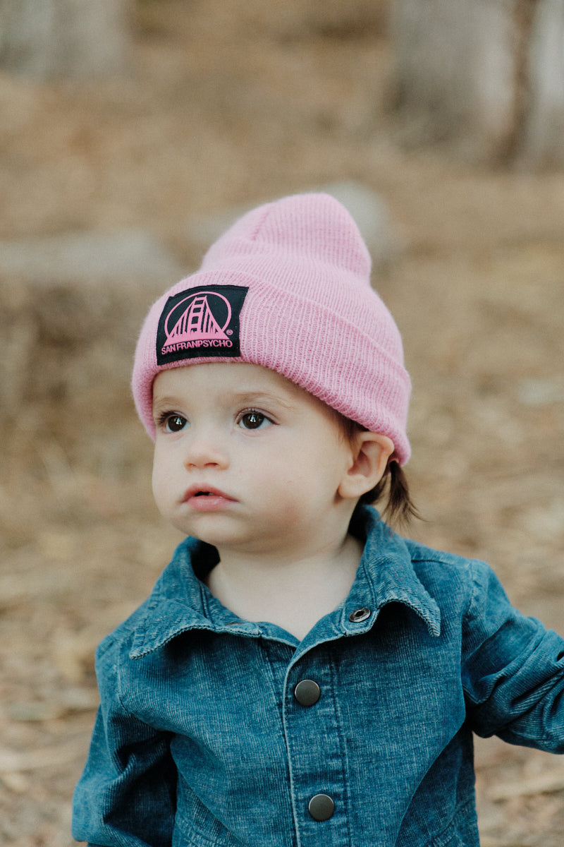 toddler wearing Pink Baby Beanie w/ Black/Pink Logo Patch
