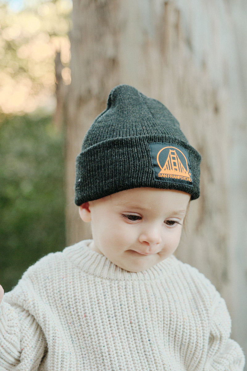 toddler wearing Black Baby Beanie w/Black/Orange Logo
