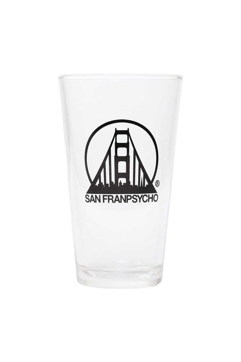 The SFP Logo Pint Glass is a 16 oz. clear glass boasting a striking black logo of the Golden Gate Bridge, paired with the iconic San Franpsycho text.