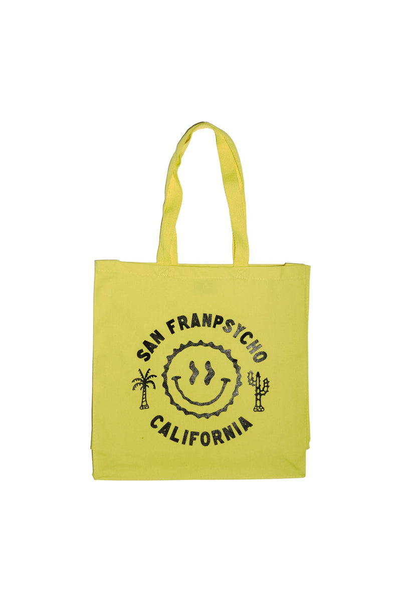 The Yellow & Black Smiley Tote showcases a vibrant yellow design with San Franpsycho California and a cheerful black smiley face, complemented by hand-printed palm and cactus icons, capturing San Franciscos spirit.