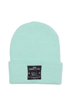 Mint knit beanie for kids featuring a black Wet n Wreckless patch on the front cuff—perfect for staying warm and stylish.