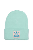 The Mint Kids Beanie w/ Natural/Teal Logo features a folded brim and patch with a blue bridge and San Franpsycho text—one of our most stylish beanies, perfect for keeping cozy on chilly days.
