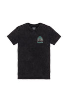 The Mind Bloom Tee is a black mineral wash shirt with a small, colorful skull and mushroom graphic on the left chest, inspired by Erik Abel’s artwork.