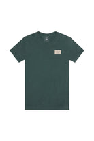 The Bridge Co Tee is a dark green heavyweight cotton shirt with a small rectangular logo patch on the left chest, ideal for a workwear-inspired style.
