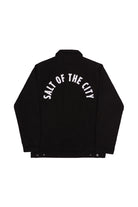 The Bridge Co. Chore Jacket features SALT OF THE CITY in white arched text on the upper back and offers classic workwear style, proudly made in San Francisco.