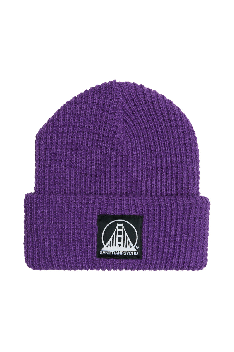 The Purple Waffle Beanie w/ Black/White Logo features a black patch with a white bridge and San Franpsycho on the front cuff, making this cozy acrylic beanie perfect for fans of city-inspired style.