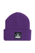 The Purple Waffle Beanie w/ Black/White Logo features a black patch with a white bridge and San Franpsycho on the front cuff, making this cozy acrylic beanie perfect for fans of city-inspired style.