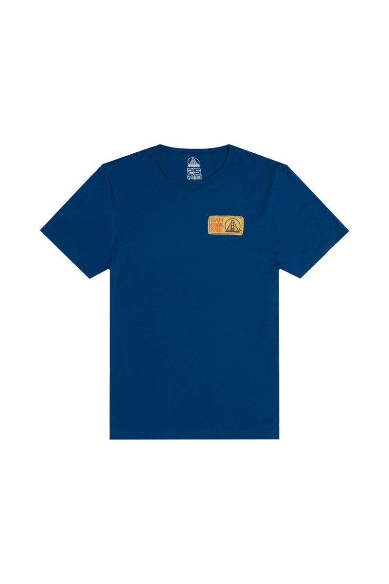 The Elemental Tee - Blue is a 100% cotton short sleeve shirt with a small rectangular patch on the left chest.