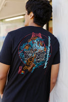 A man wears the Year of the Horse Tee, featuring a vibrant graphic on the back, standing outdoors—an ideal choice for celebrating Lunar New Year in style.