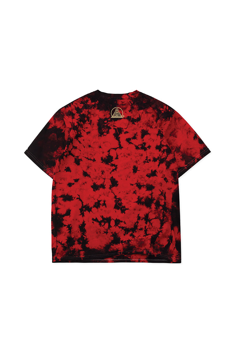Gold Rush Tee - Red Crystal Dye: A unisex tee in red and black crystal dye, featuring a small white circular logo near the upper back neckline—perfect for any 49ers fan chasing that Gold Rush spirit.