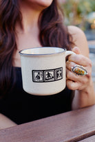 Speckled ceramic Icons Mug featuring icons of a bottle, a surfer, and a UFO.