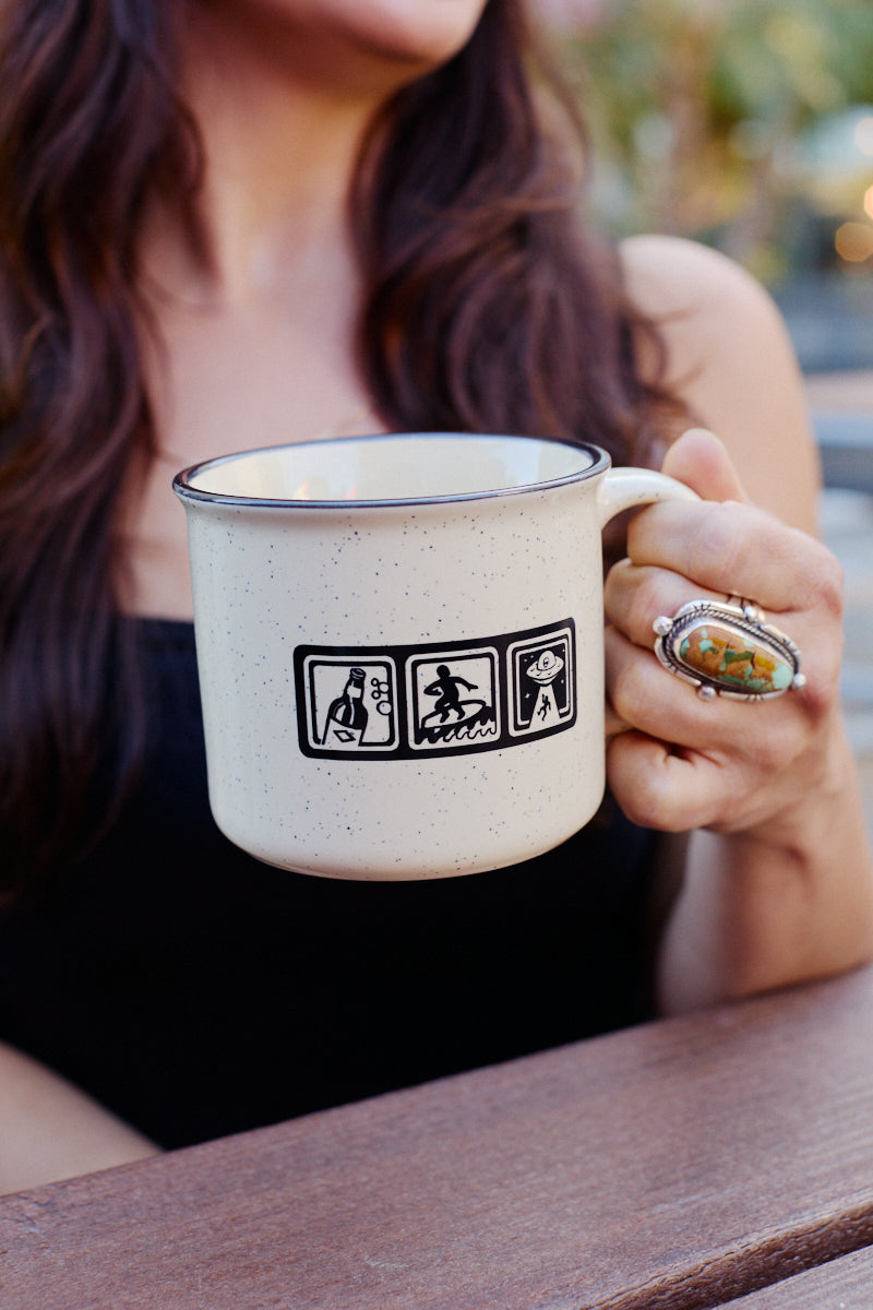 Speckled ceramic Icons Mug featuring icons of a bottle, a surfer, and a UFO.
