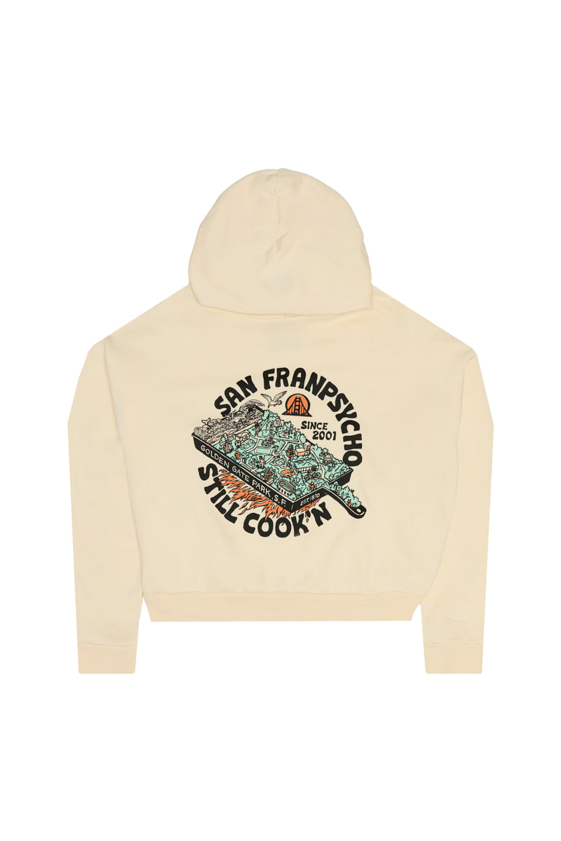 Cream cropped Still Cookin’ Crop Hoodie featuring a back graphic of a stylized Golden Gate Park map with text.