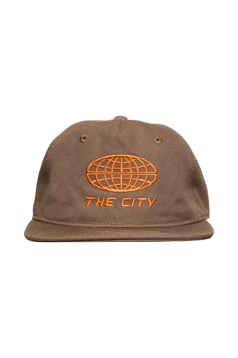 Brown The City Hat snapback featuring an embroidered orange globe icon and the text THE CITY.