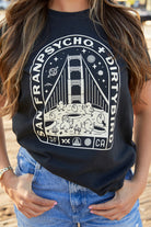 A woman wears the Moon Bridge Tee, a Dirtybird collaboration showcasing a San Francisco-inspired Golden Gate Bridge graphic.