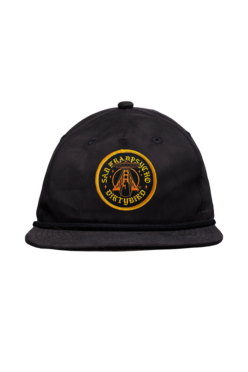 Dirty UFO Hat: Black baseball cap with a yellow embroidered circular patch featuring text and a bridge—celebrating Bay Area culture in this unique SFP x Dirtybird collaboration.