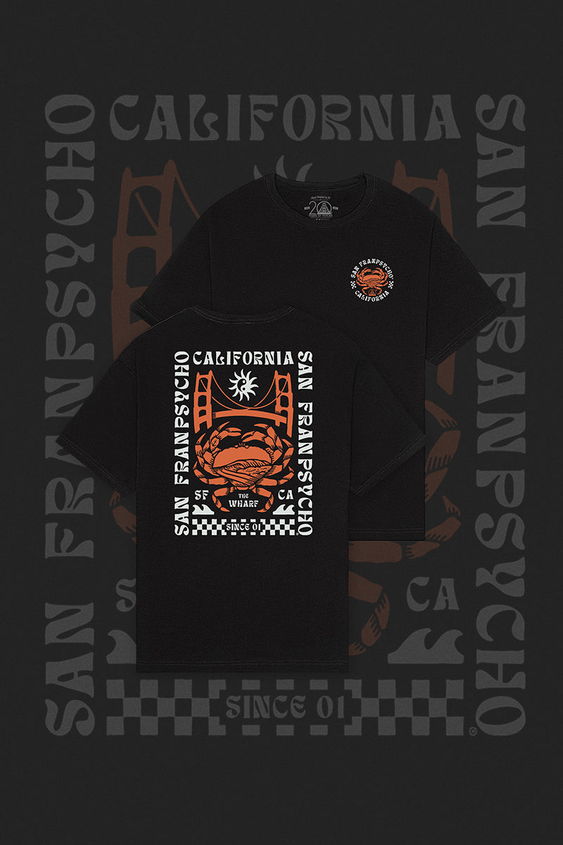The Wharf Crab Tee features a black design with California San Francisco and a psycho crab, highlighted by white and orange accents inspired by Fishermans Wharf.