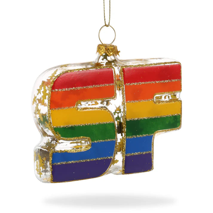 Locally inspired rainbow-colored "Xmas Ornaments - Local Elves" ornament, featuring a rainbow SF and gold glitter accents, suspended by a thin gold string.