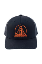 The Embroidered Logo Trucker Hat in black and orange boasts an adjustable fit and features a stylized San Franpsycho logo with a Golden Gate Bridge design, blending comfort and style for casual outings.